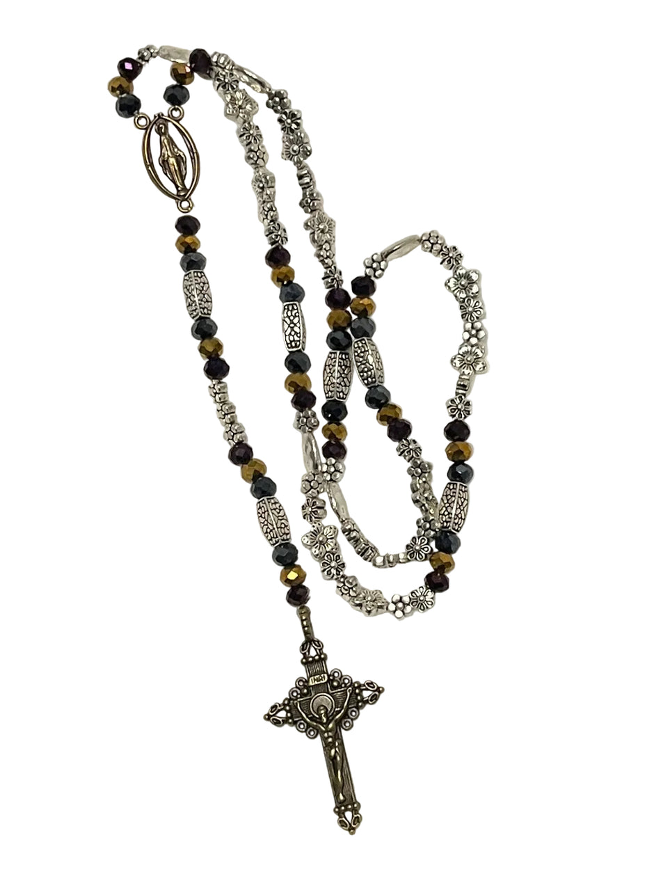 Handcrafted 5-decade mixed metal rosary with charcoal, brass, and dark purple rondelle glass beads, a brass Miraculous Medal, and a crucifix.
