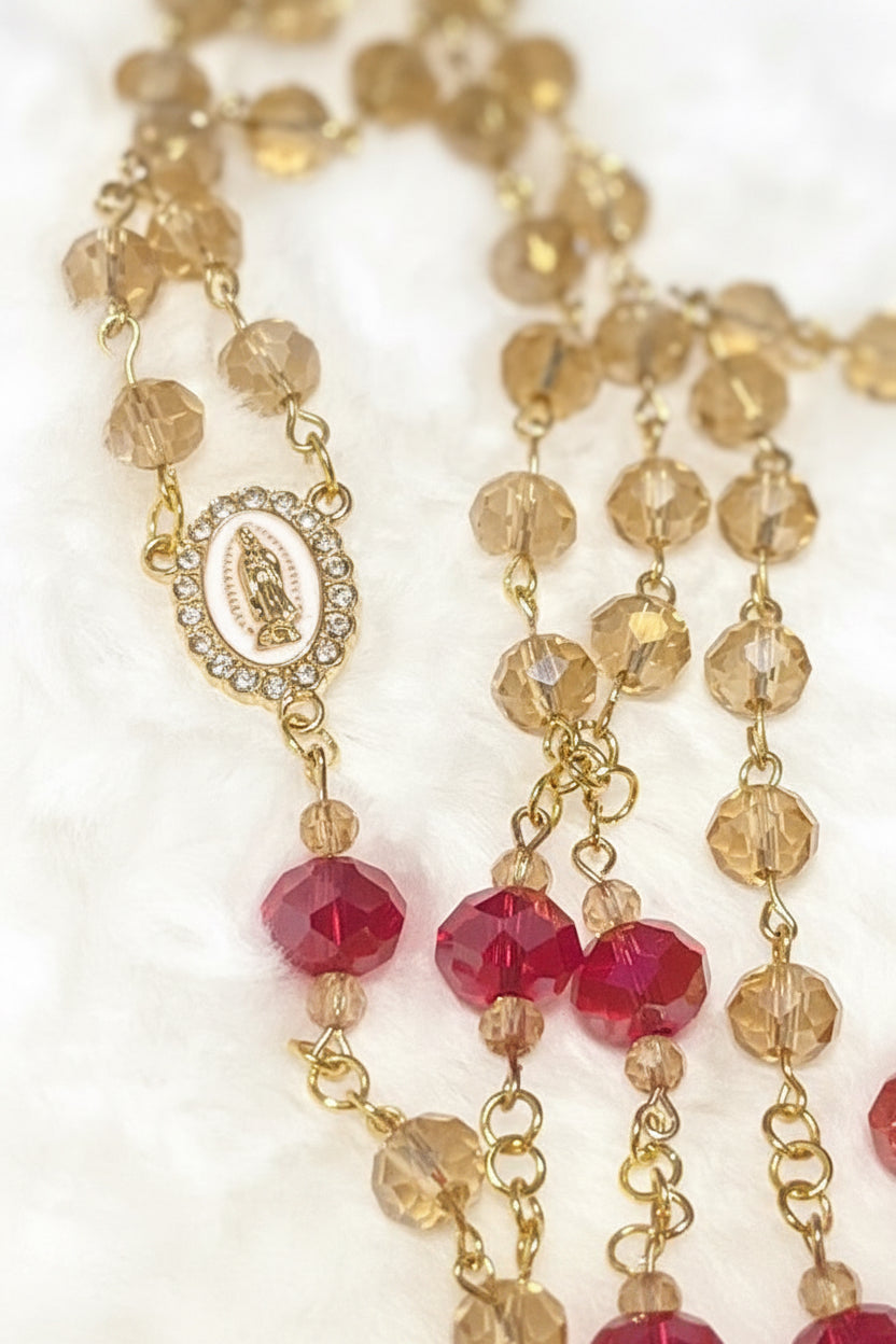 Handcrafted 5-decade champagne glass rosary with red beads, a white enamel Virgin de Guadalupe center, and a matching gold St. Benedict crucifix.