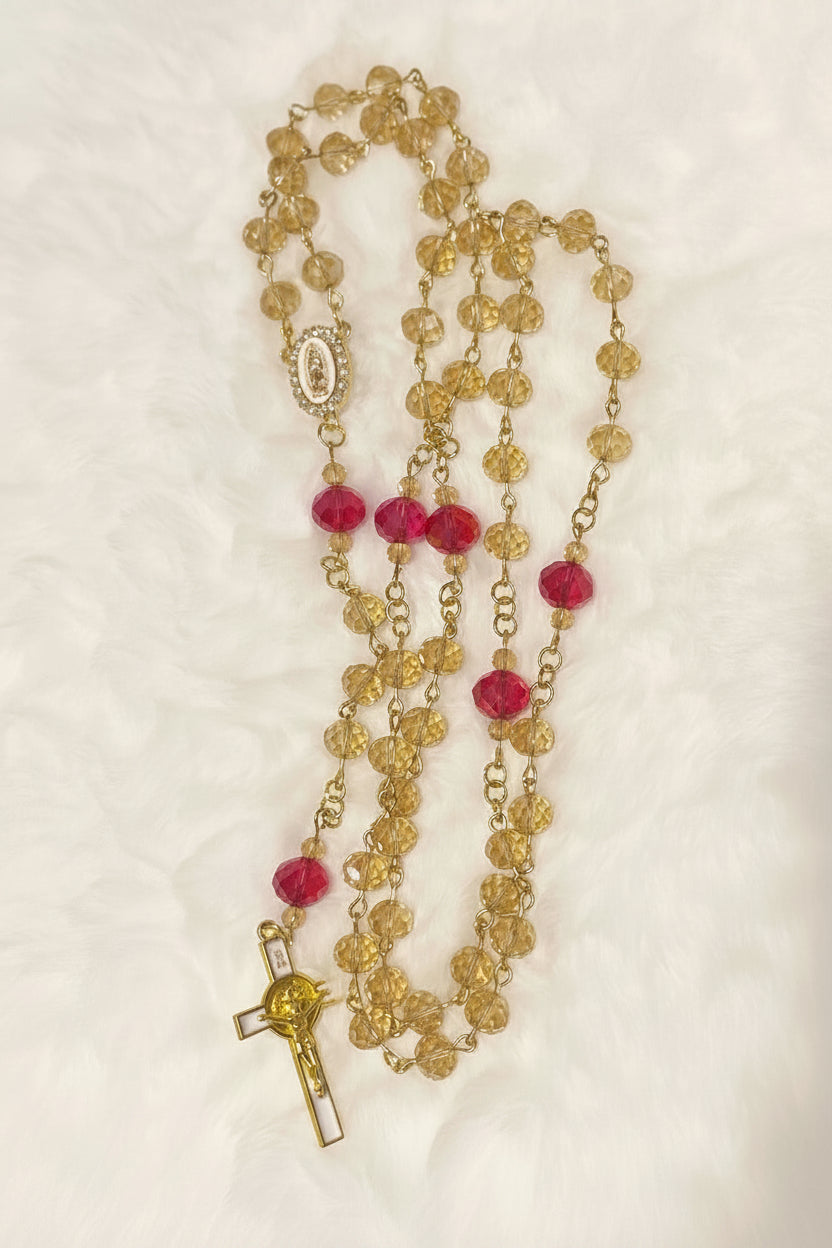 Handcrafted 5-decade champagne glass rosary with red beads, a white enamel Virgin de Guadalupe center, and a matching gold St. Benedict crucifix.