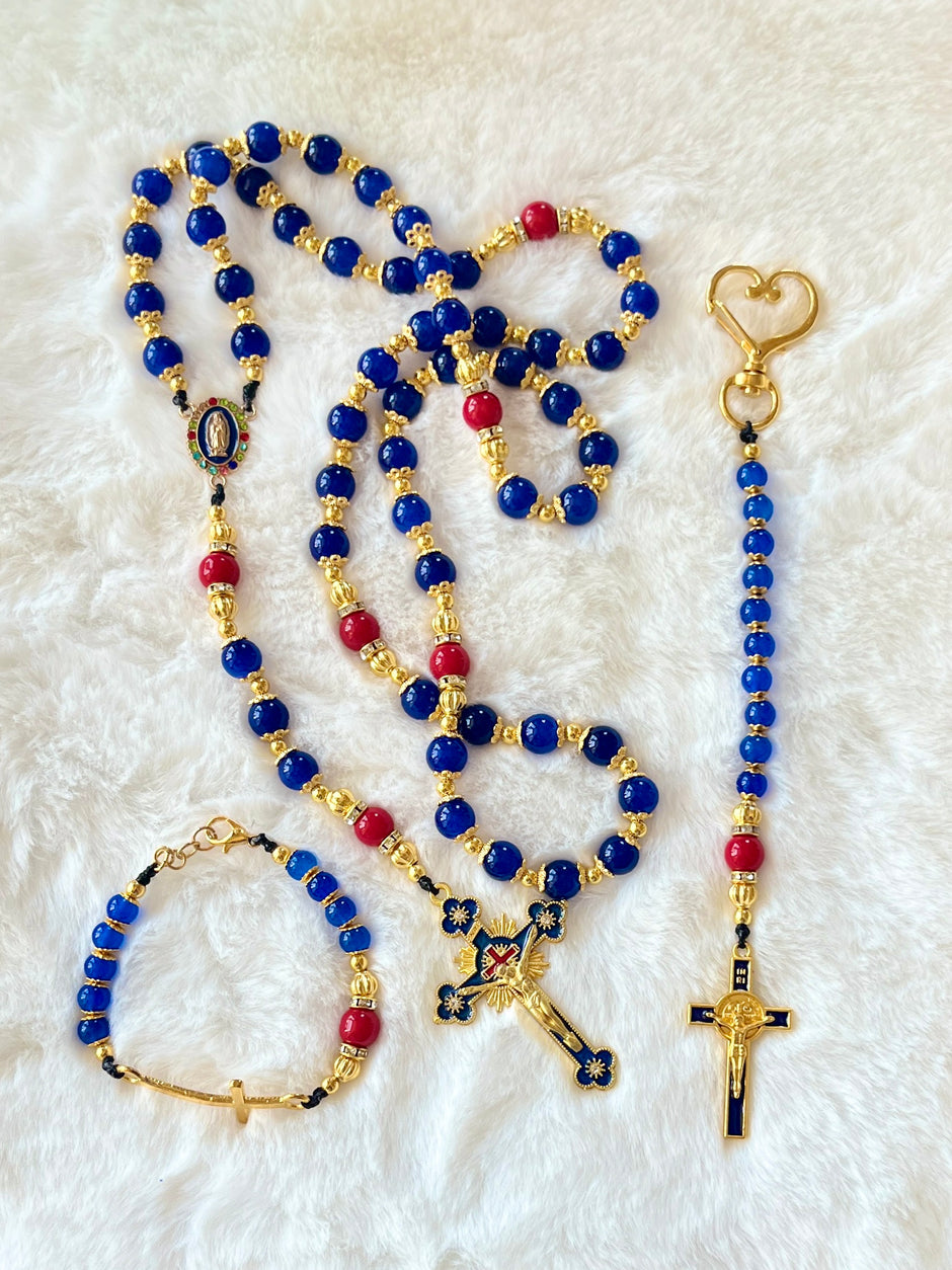 Handcrafted 3-piece Catholic gift set featuring a full 5-decade cobalt glass rosary, a matching gold heart clasp keychain, and a coordinated gold cross bracelet.