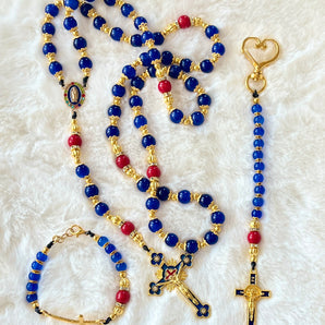Handcrafted 3-piece Catholic gift set featuring a full 5-decade cobalt glass rosary, a matching gold heart clasp keychain, and a coordinated gold cross bracelet.