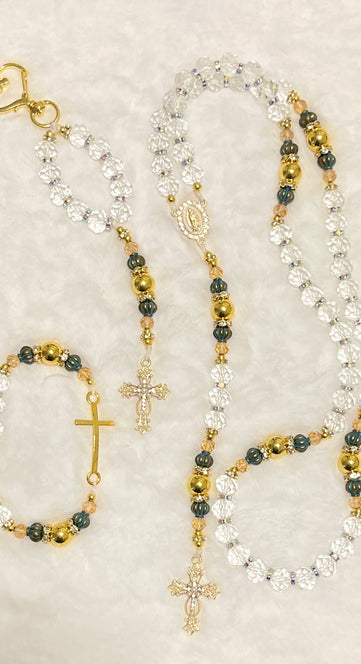 Handcrafted 3-piece Catholic gift set featuring a full 5-decade clear crystal rosary, a matching gold heart clasp keychain, and a coordinated gold cross bracelet.