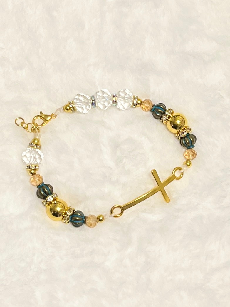 A beautiful wearable statement of faith chain-linked with a sleek curved gold cross bar, a secure lobster clasp closure, and an adjustable sizing extension chain.