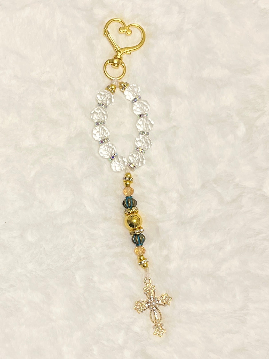 A compact accent loop equipped with a premium, large gold heart-shaped lobster clasp keychain closure and matching cross—perfect for securely adding to your car keys, purse strap, or travel bag.