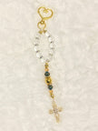 A compact accent loop equipped with a premium, large gold heart-shaped lobster clasp keychain closure and matching cross—perfect for securely adding to your car keys, purse strap, or travel bag.