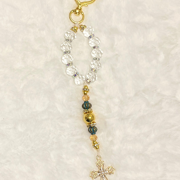 A compact accent loop equipped with a premium, large gold heart-shaped lobster clasp keychain closure and matching cross—perfect for securely adding to your car keys, purse strap, or travel bag.