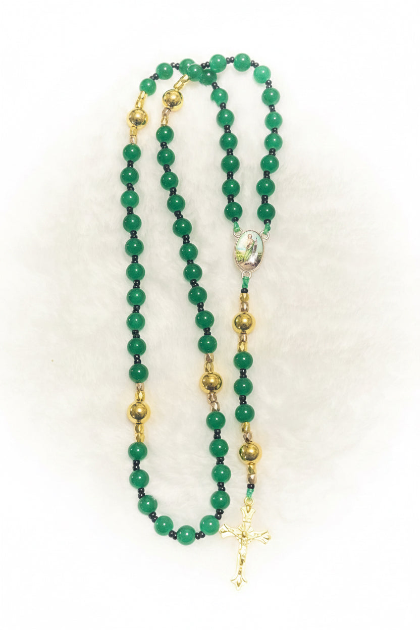 Handcrafted 5-decade green glass rosary with premium 14k gold-plated beads, a St. Jude medal, and a sunburst crucifix. A timeless Catholic heirloom gift.