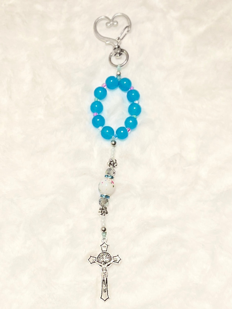 A matching accent loop equipped with a premium, large heart-shaped lobster clasp keychain closure and a silver crucifix—perfect for securely adding to your car keys, purse strap, or travel bag.