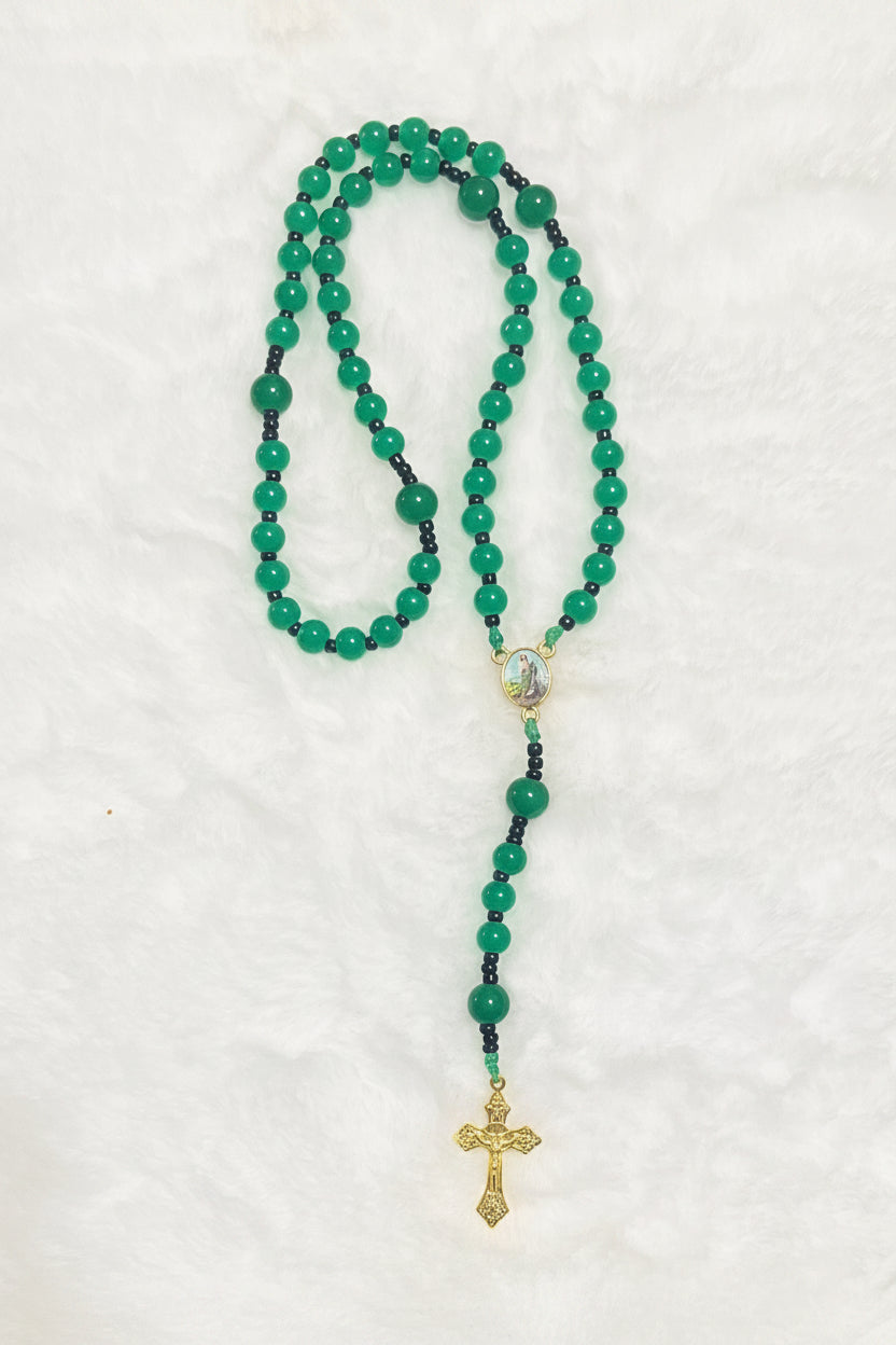 Handcrafted compact 5-decade green glass bead rosary featuring a St. Jude center medal and a sunburst crucifix. Portable design, ideal for handheld prayer.