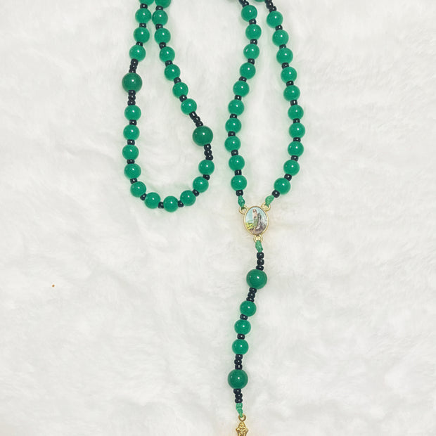 Handcrafted compact 5-decade green glass bead rosary featuring a St. Jude center medal and a sunburst crucifix. Portable design, ideal for handheld prayer.