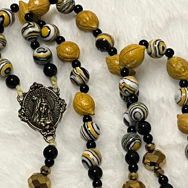 Handcrafted 5-decade yellow wooden lemon bead rosary with patterned accents, an Immaculate Heart of Mary center, and a St. Alphonsus crucifix.