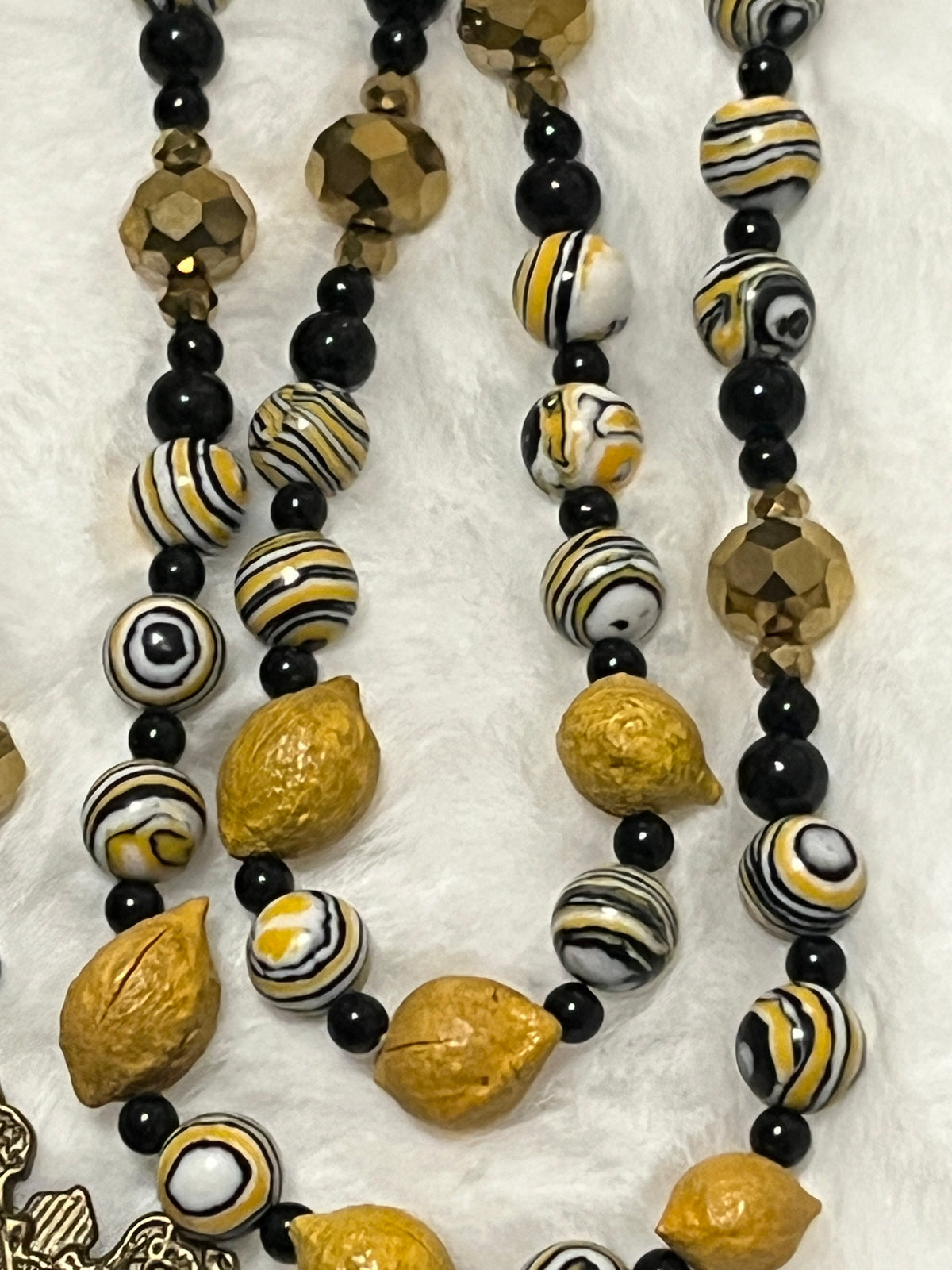Handcrafted 5-decade yellow wooden lemon bead rosary with patterned accents, an Immaculate Heart of Mary center, and a St. Alphonsus crucifix.